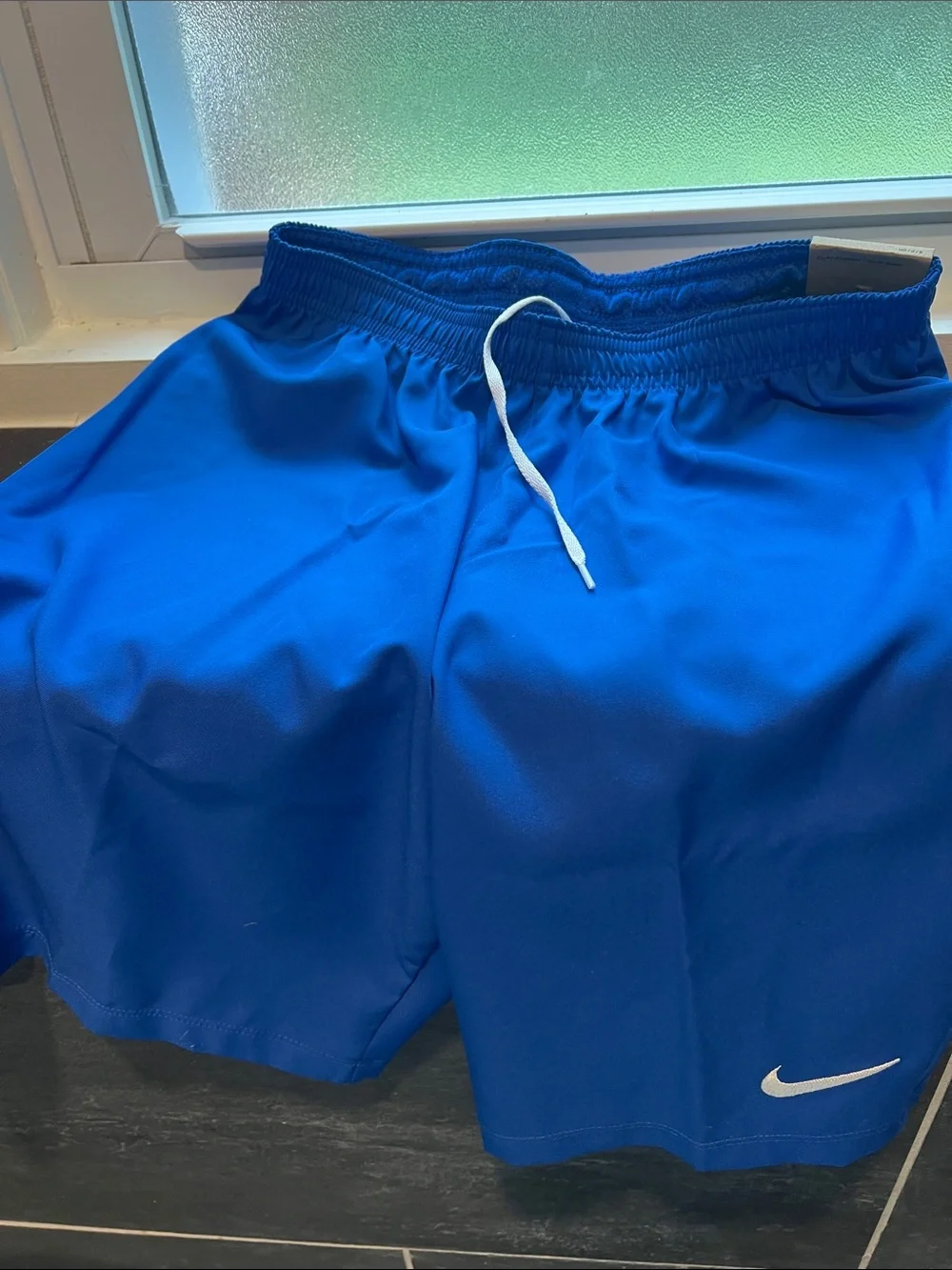 Nike Men's Athletic Shorts blue with white Swoosh size small
